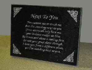 Simple black granite memorial plaque